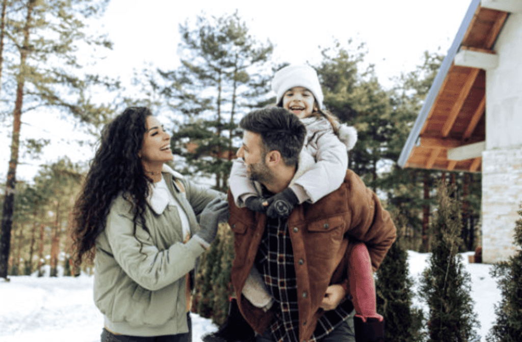 winter weekend activities for families featured image mom and dad with daughter outdoors